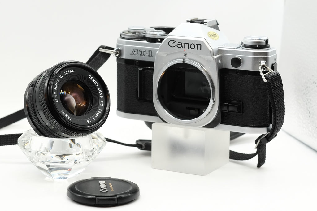 Canon AT-1 + Canon FD 50mm 1.8 + Canon 135mm + 70-210mm + Winder