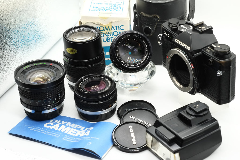 Olympus OM-2 Spot/Program + Olympus 50mm 1.4 + Olympus 28mm 2.8 + Olympus 135mm + Tokina 17mm