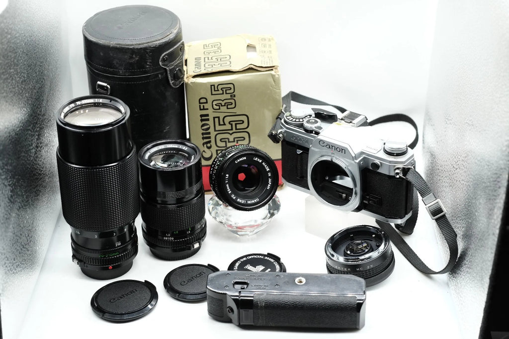 Canon AT-1 + Canon FD 50mm 1.8 + Canon 135mm + 70-210mm + Winder