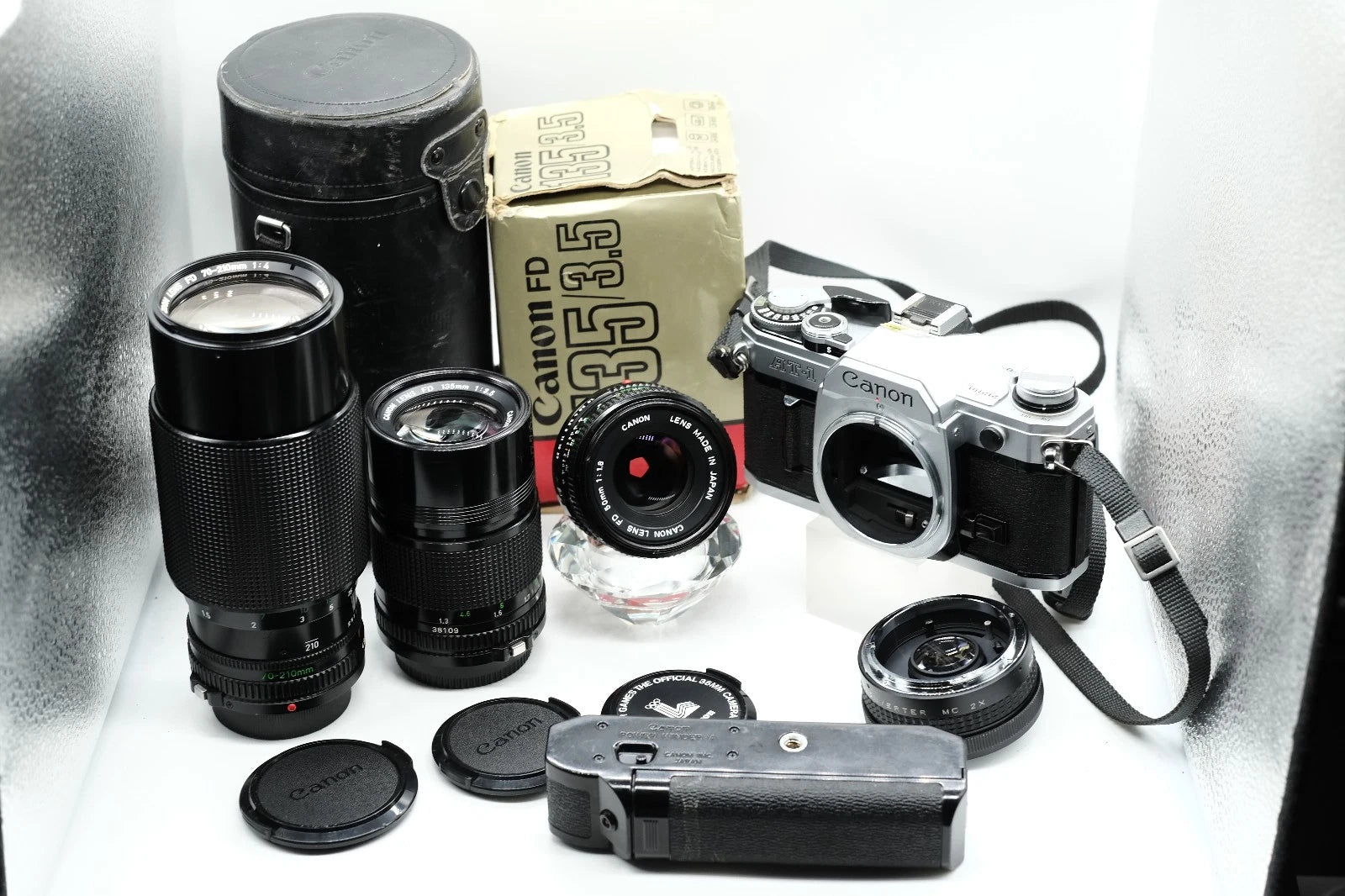 Canon AT-1 + Canon FD 50mm 1.8 + Canon 135mm + 70-210mm + Winder