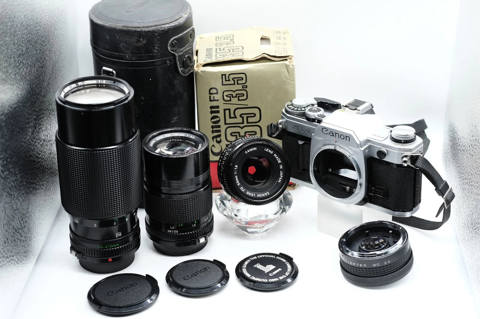 Canon AT-1 + Canon FD 50mm 1.8 + Canon 135mm + 70-210mm + Winder