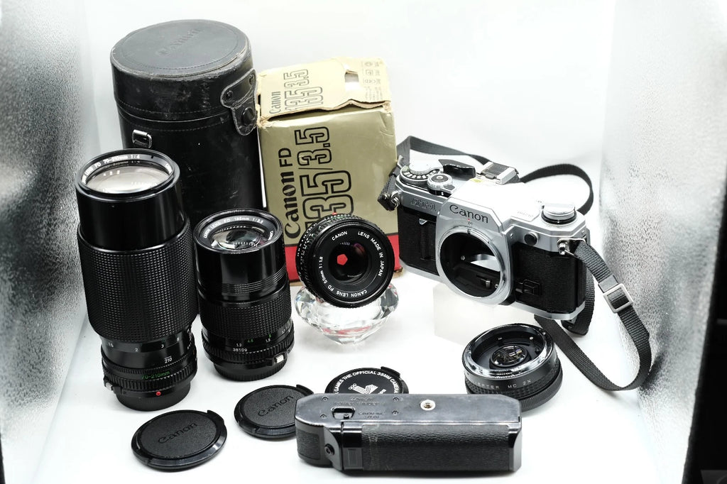 Canon AT-1 + Canon FD 50mm 1.8 + Canon 135mm + 70-210mm + Winder