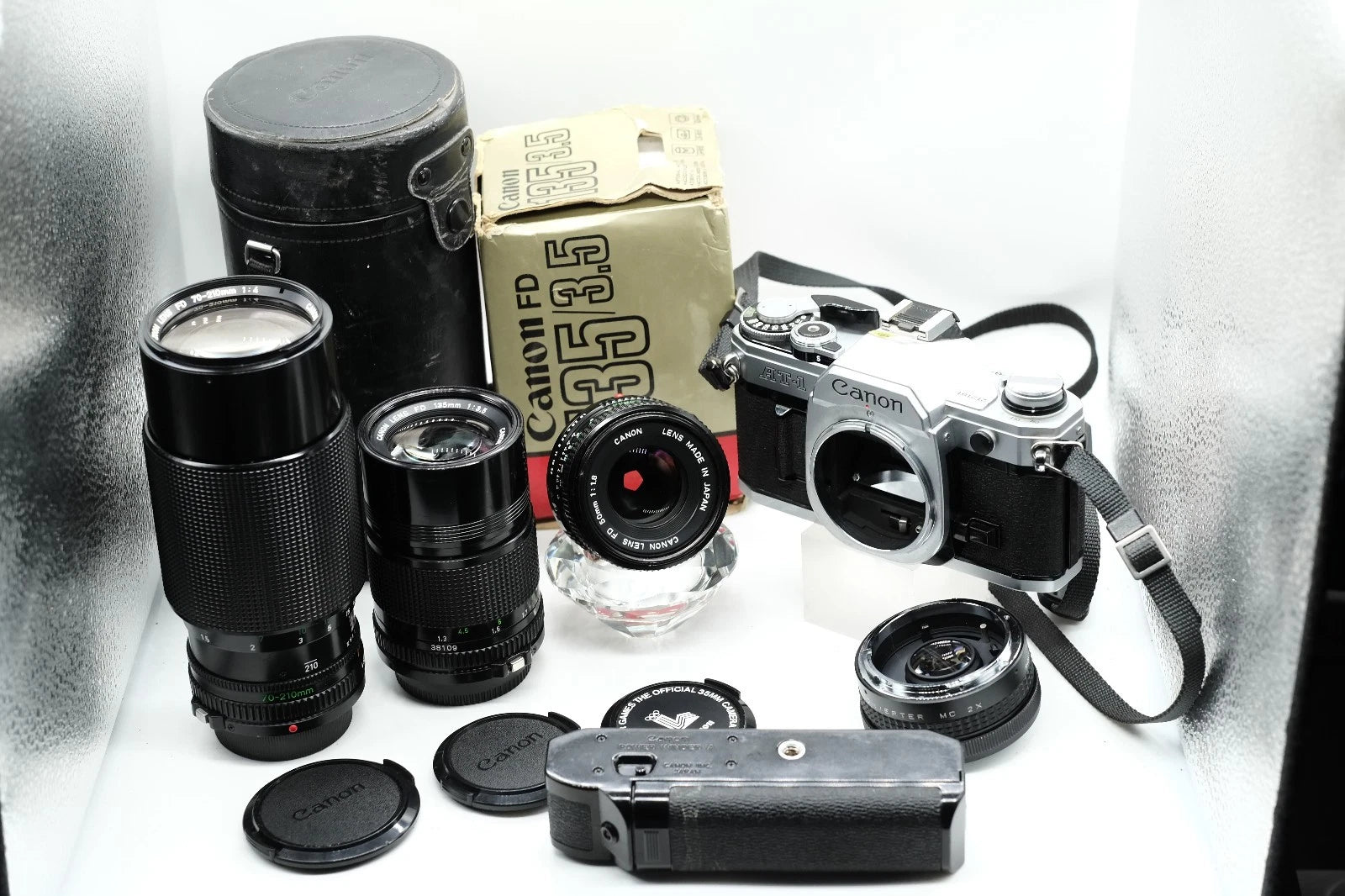 Canon AT-1 + Canon FD 50mm 1.8 + Canon 135mm + 70-210mm + Winder